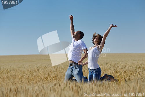 Image of happy couple in wheat field