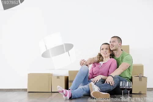 Image of Young couple moving in new home