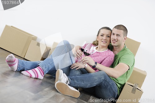 Image of Young couple moving in new home