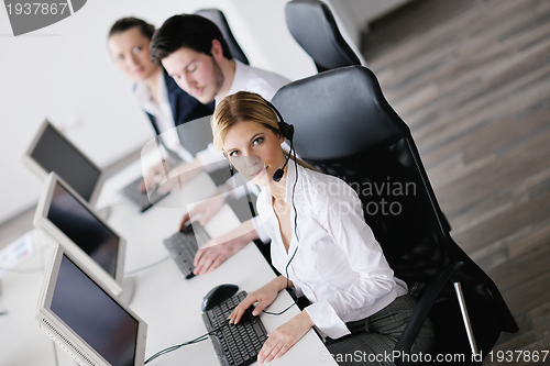 Image of business people group working in customer and help desk office