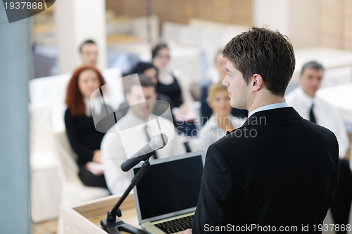 Image of Young  business man giving a presentation on conference