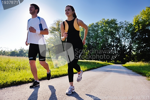 Image of Young couple jogging