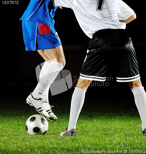 Image of football players in action for the ball