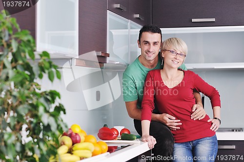 Image of young couple have fun in modern kitchen