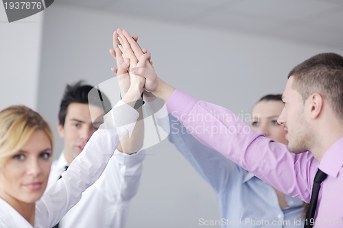 Image of business people group joining hands