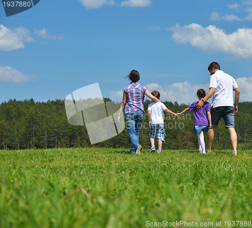 Image of happy young family have fun outdoors