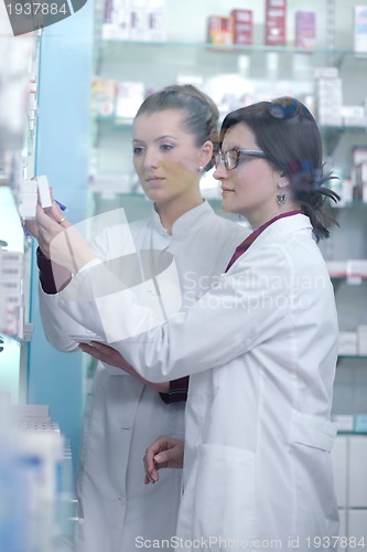 Image of team of pharmacist chemist woman  in pharmacy drugstore