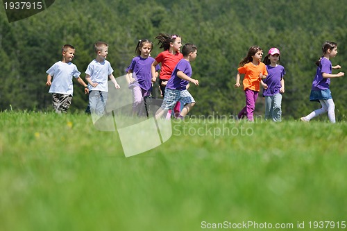 Image of happy kids group  have fun in nature