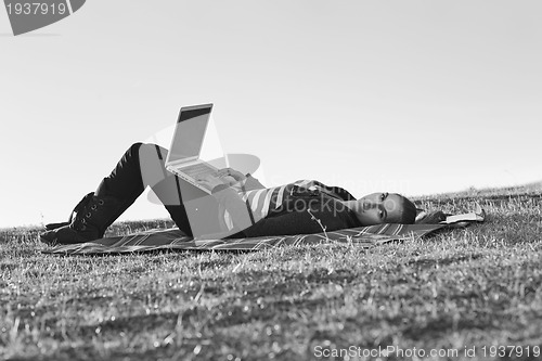 Image of young teen girl work on laptop outdoor