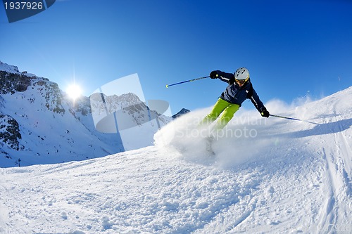 Image of skiing on fresh snow at winter season at beautiful sunny day