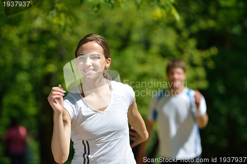 Image of Young couple jogging