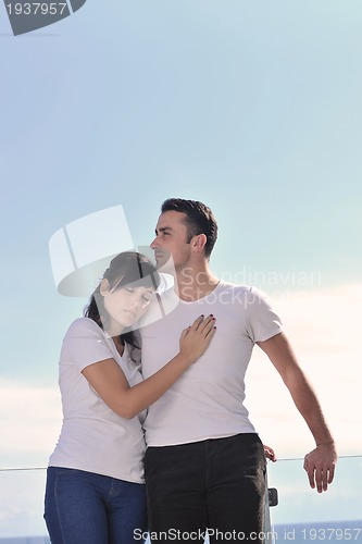 Image of couple relaxing on balcony