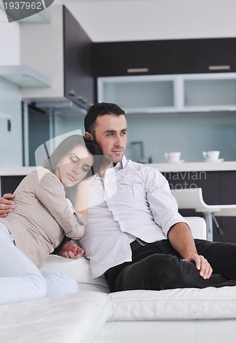 Image of happy young couple relax at home