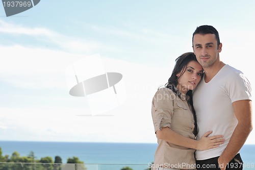 Image of couple relaxing on balcony