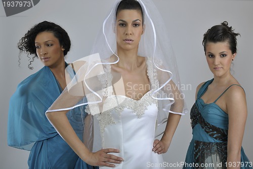 Image of portrait of a three beautiful woman in wedding dress