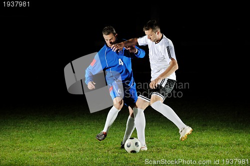 Image of football players in action for the ball