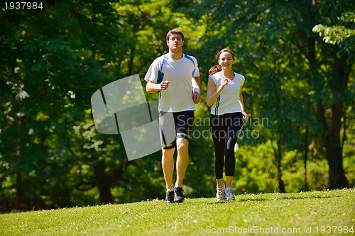 Image of Young couple jogging