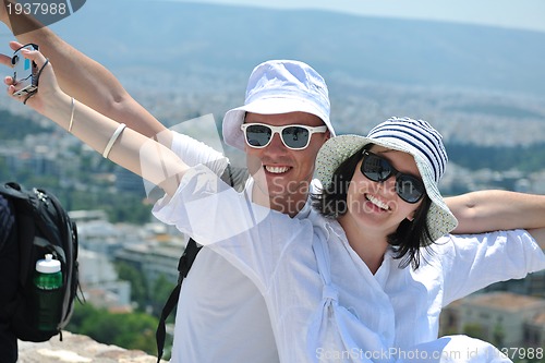 Image of happy young couple tourists in greece