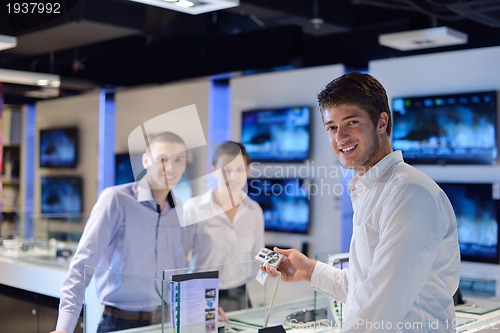 Image of people buy  in consumer electronics store