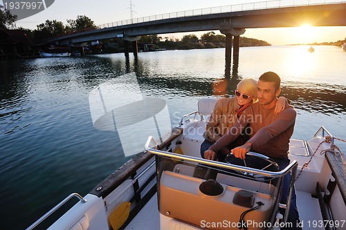 Image of couple in love  have romantic time on boat