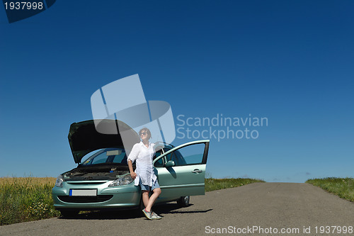 Image of woman with broken car