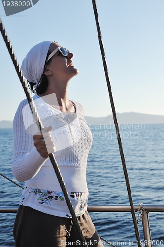 Image of Greek woman on the streets of Oia, Santorini, Greece