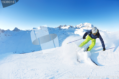 Image of skiing on fresh snow at winter season at beautiful sunny day