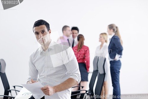 Image of young business man at meeting