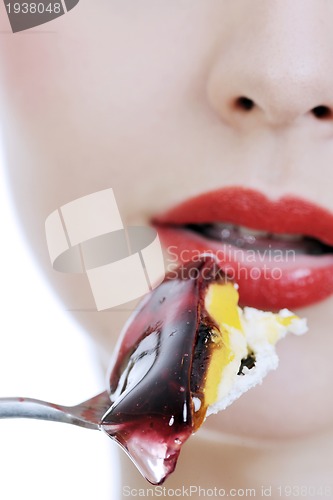Image of beautiful young woman eat sweet cake