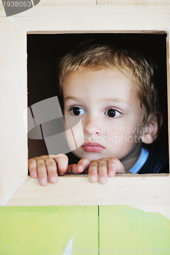 Image of happy child in a window