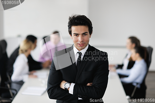 Image of young business man at meeting