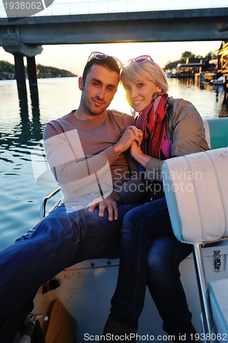 Image of couple in love  have romantic time on boat