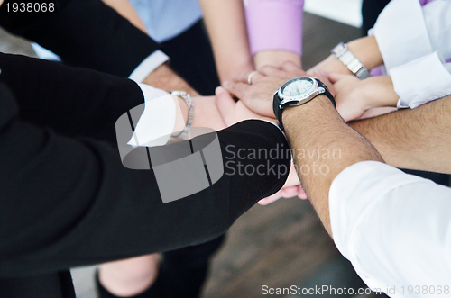 Image of business people group joining hands