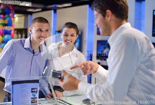 Image of people buy  in consumer electronics store