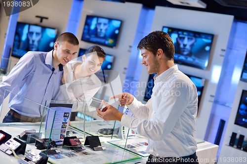 Image of people buy  in consumer electronics store