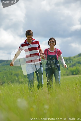 Image of romantic young couple in love together outdoor