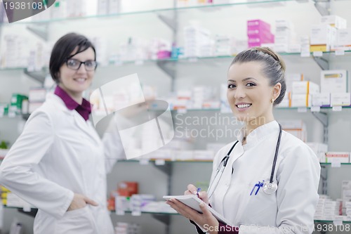 Image of team of pharmacist chemist woman  in pharmacy drugstore