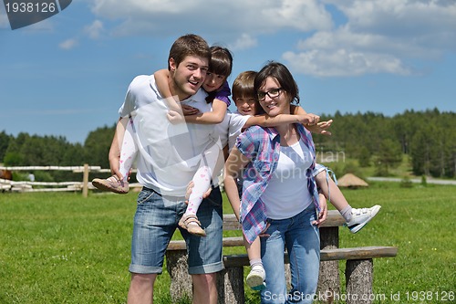 Image of happy young family have fun outdoors