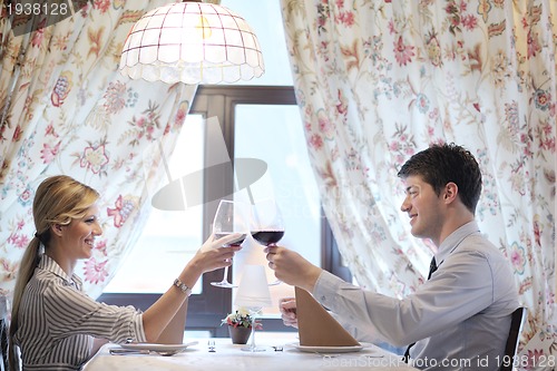 Image of young couple having dinner at a restaurant