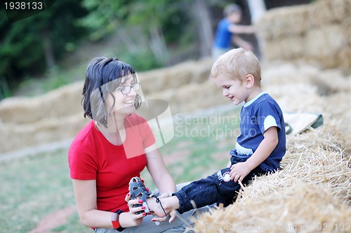 Image of woman and child have fun outdoor