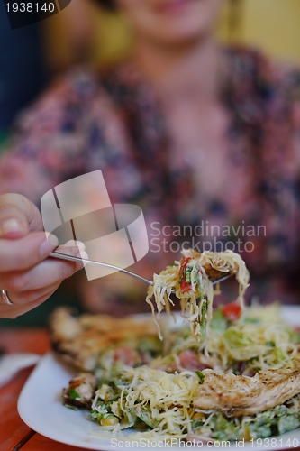 Image of woman eat salad
