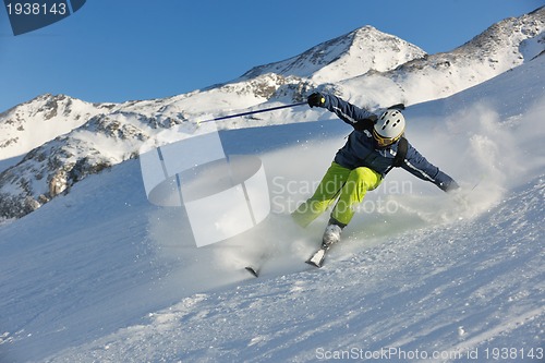 Image of skiing on fresh snow at winter season at beautiful sunny day