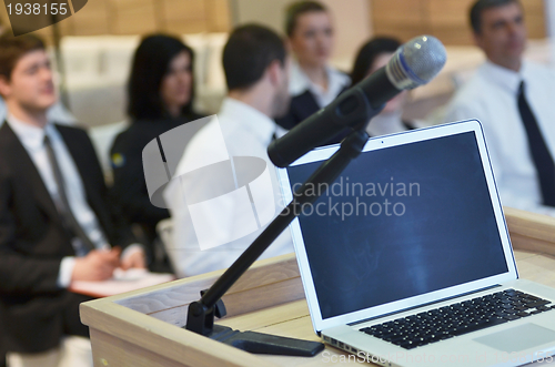 Image of laptop on conference speech podium