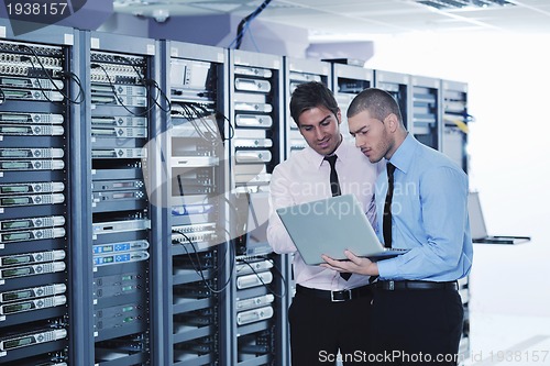 Image of it enineers in network server room