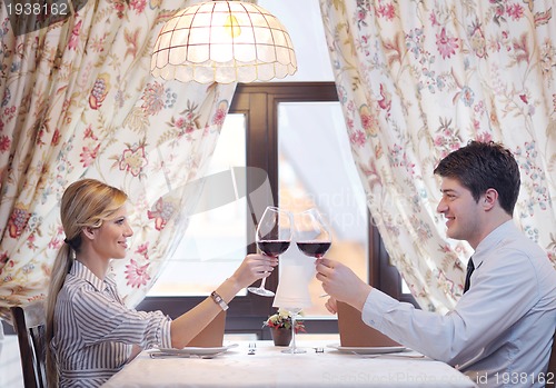 Image of young couple having dinner at a restaurant