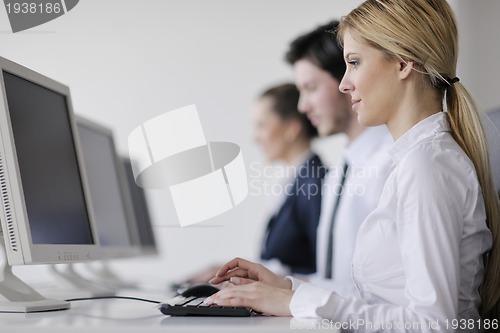 Image of business people group working in customer and help desk office