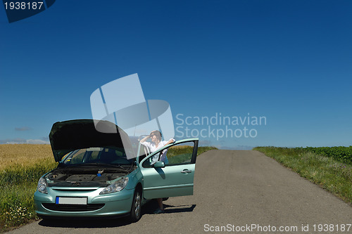 Image of woman with broken car