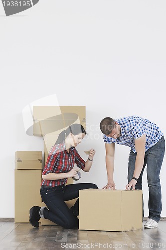 Image of Young couple moving in new home