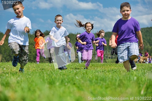 Image of happy kids group  have fun in nature