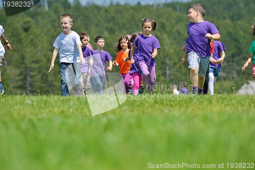 Image of happy kids group  have fun in nature